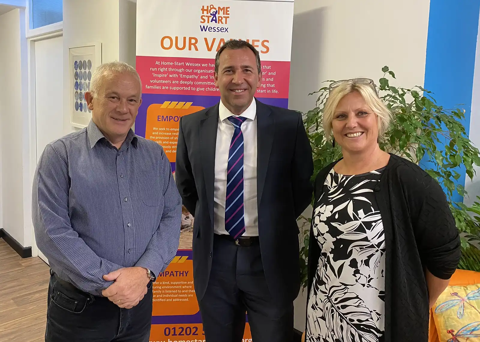 Chris Thomas and Kathy Fryatt-Banks, of Home-Start Wessex, with Gary Collins of PJ Aiken, centre