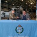 Armishaws general manager, Pat Carter, signing the Armed Forces Pledge in November last year