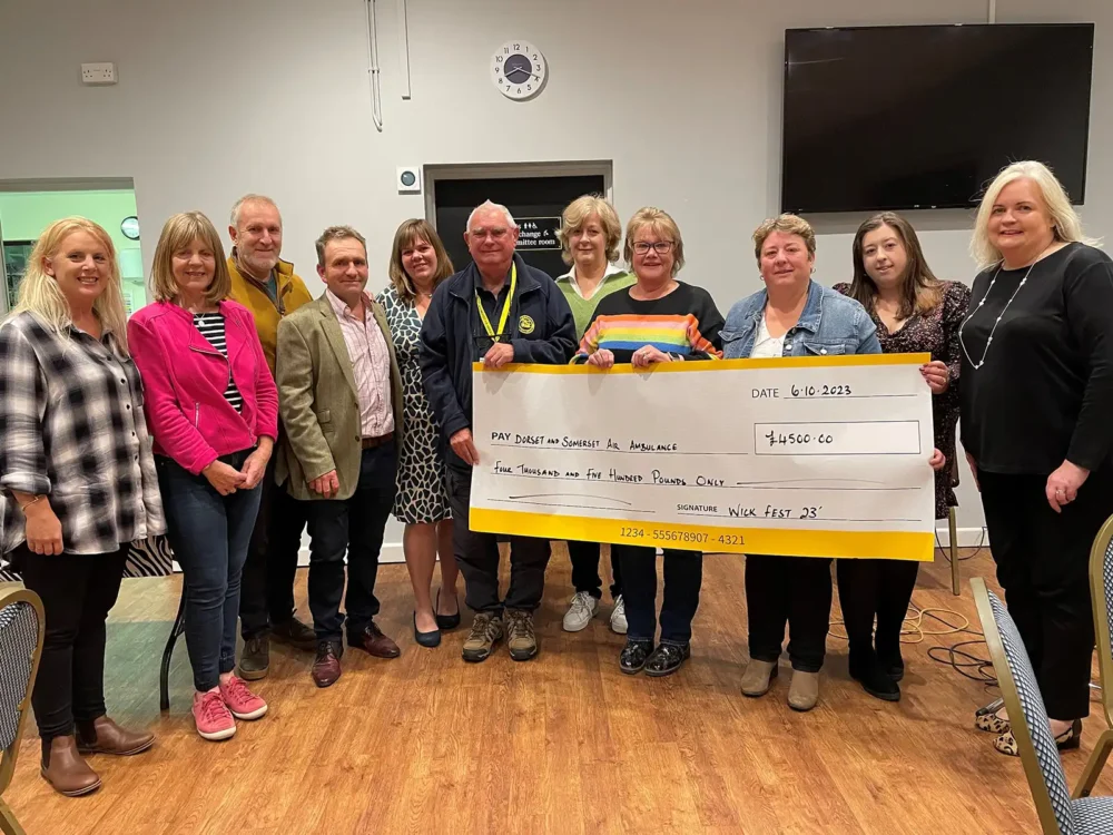 Members of the Wickfest organising committee recently presented a cheque for £4,500 to Dorset and Somerset Air Ambulance