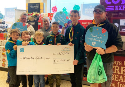 Co-op staff hand over the donation to 1st Wincanton Scouts