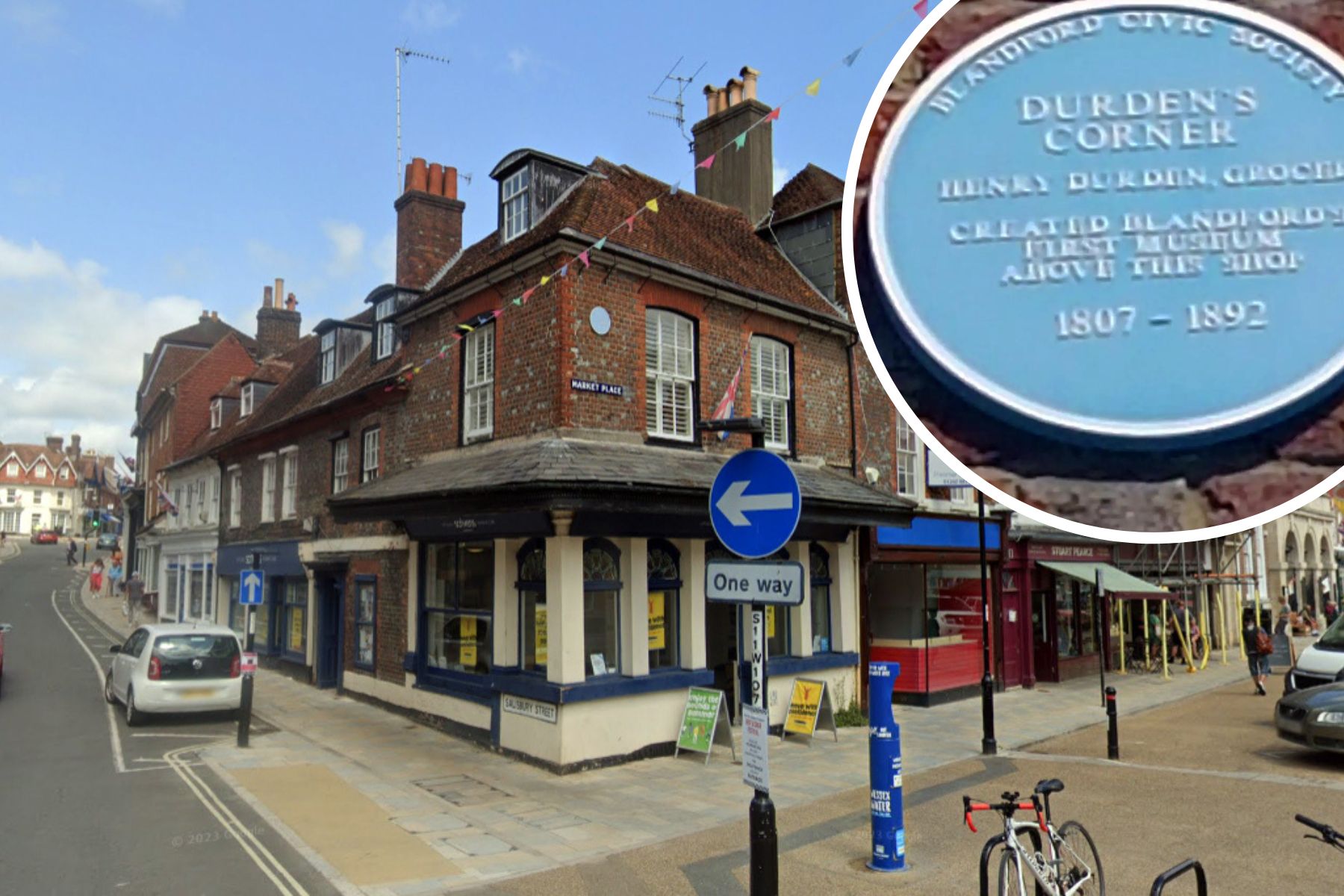 The mystery blue plaque is installed above Scrivens, at 9 Market Place, Blandford