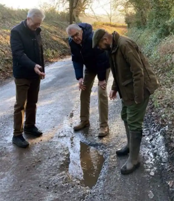 Cllr John Feltham, left, chair of Donhead St Mary Parish Council inspecting potholes with Cllr Richard Budden and chair of Donhead St Andrew PC, Cllr Simon Barkham