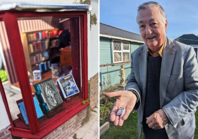 Leonard Martin holds a bundle of miniature New Blackmore Vales - which are in the window of his tiny bookshop