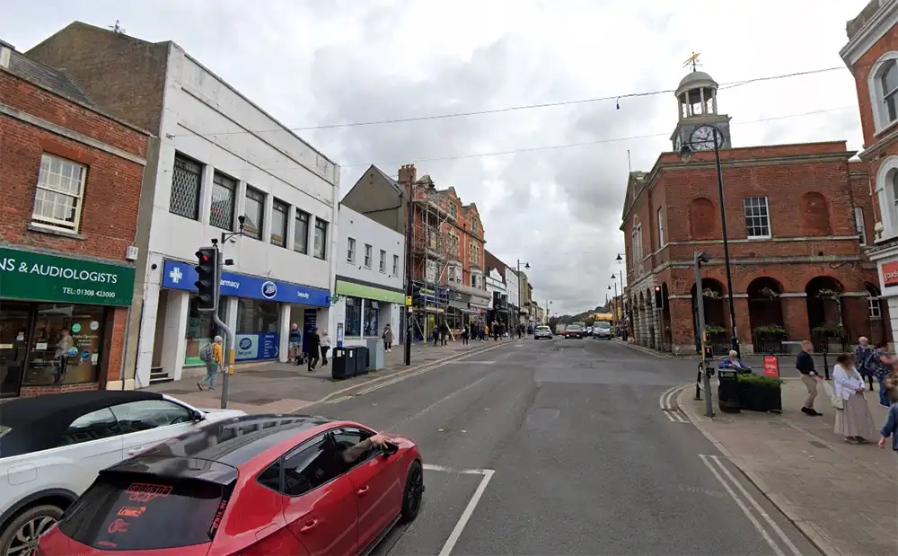 The pedestrian was hit by a car in West Street, Bridport, near the junction with South Street. Picture: Google