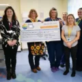 Hazel Hoskin presents a cheque for £15,400 to the Special Care Baby Unit at DCH