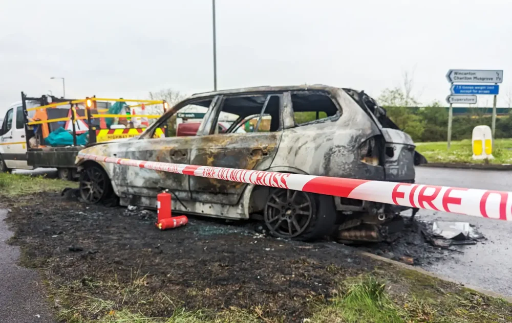 The BMW is left burned out on the roundabout near McDonald's in Wincanton. Picture: New Blackmore Vale