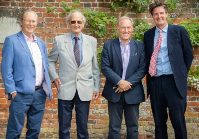 David Pritchard, second left, with former headteachers Peter Dix, left, and Stephen Ilett, second right, and current head Titus Mills, at Port Regis in 2022