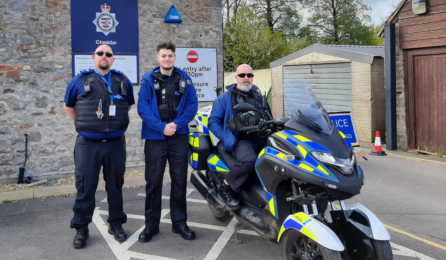The Cheddar Neighbourhood Policing team with a hybrid motorcycle. Picture: Avon & Somerset Police