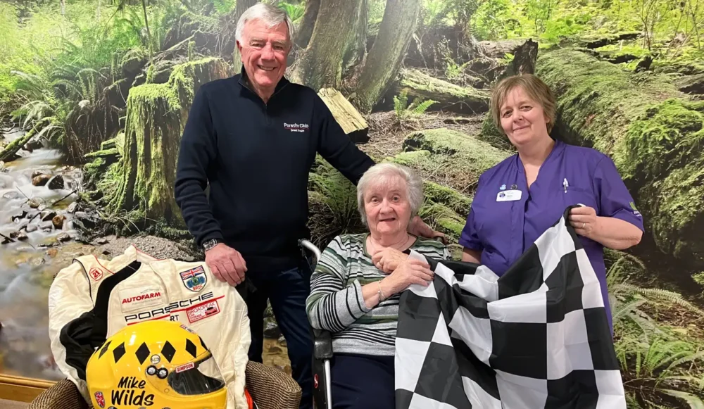 Mike with Joy and some of his motor racing memorabilia