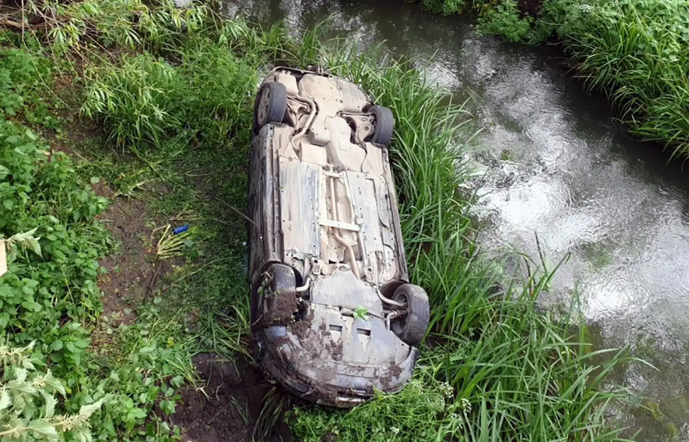 Driver rescued from car upside down in River Yeo after crash near