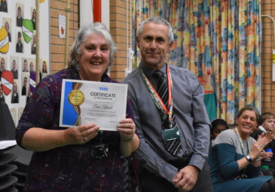 Ms Read being presented with the certificate Picture: Sherborne Primary School