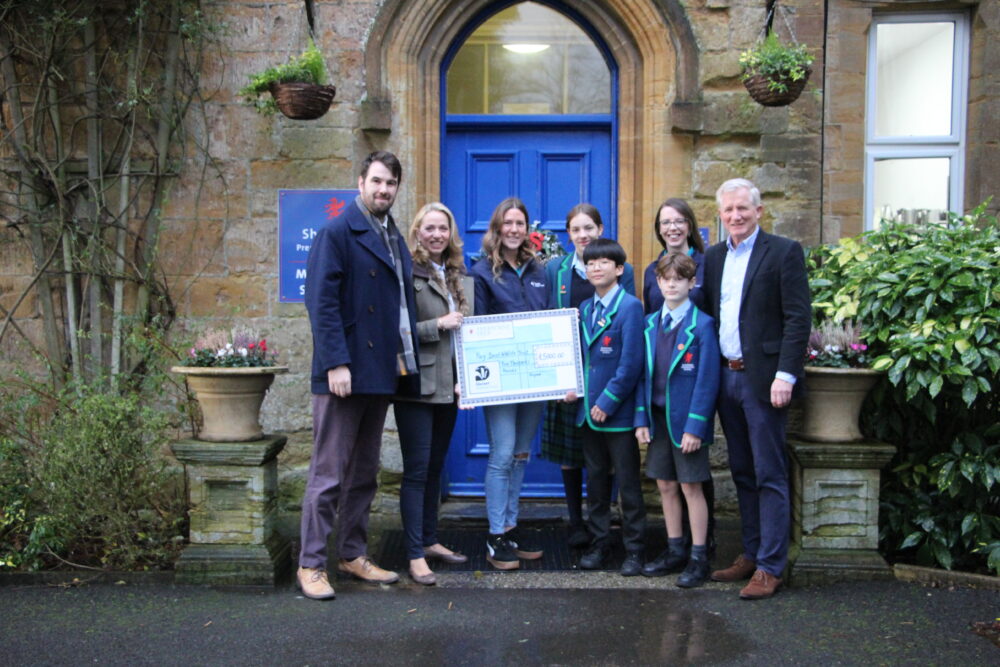 Students and staff at Sherborne Prep School handing the cheque to Dorset Wildlife Trust Picture: Dorset Wildlife Trust