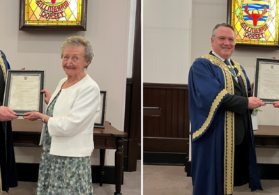 Mayor cllr Roger Weeks presenting the awards to Mary and Steve Ingham on behalf og Gillingham Imperial Silver Band Pictures: Gillingham Town Council