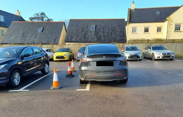 The surgery posted a picture of parking by a Tesla driver on the Sherborne site