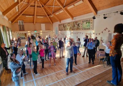 Villagers toasting the reopening of the hall Picture: Annie Noble