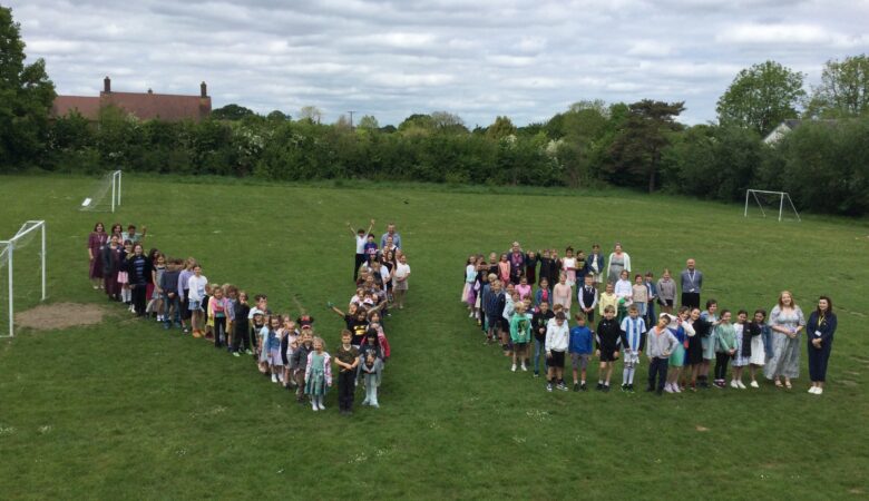 The pupils forming a giant VE Picture: St Andrew's Primary