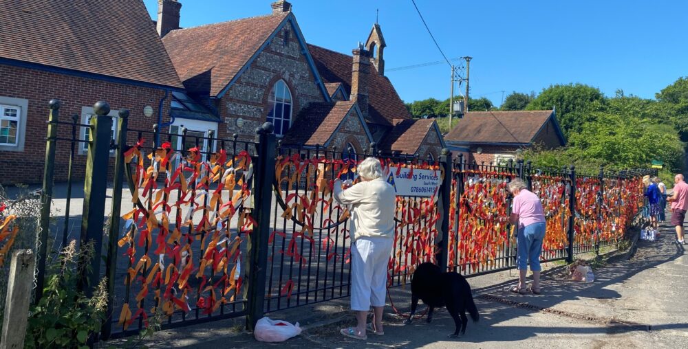 1,600 ribbons were tied to school gates during the fundraising process - approximately one ribbon for each village child that would have attended the school since 1861 Picture: Winterborne Stickland Nursery School CIC
