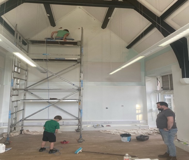 Villagers and trustees have given hours of the time to get the school up and running. Here is trustee, Hannah Ross, adding the finishing touches to the paintwork in the Baby Room Picture: Winterborne Stickland Nursery School CIC