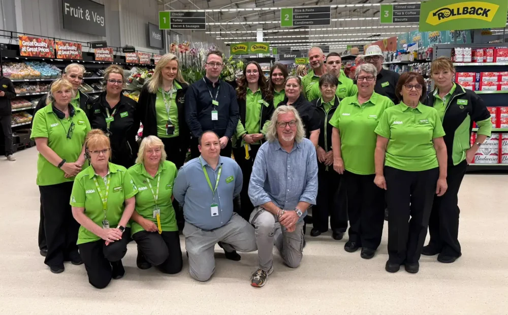 Former Top Gear host James May with staff at Asda in Gillingham. Picture: Asda