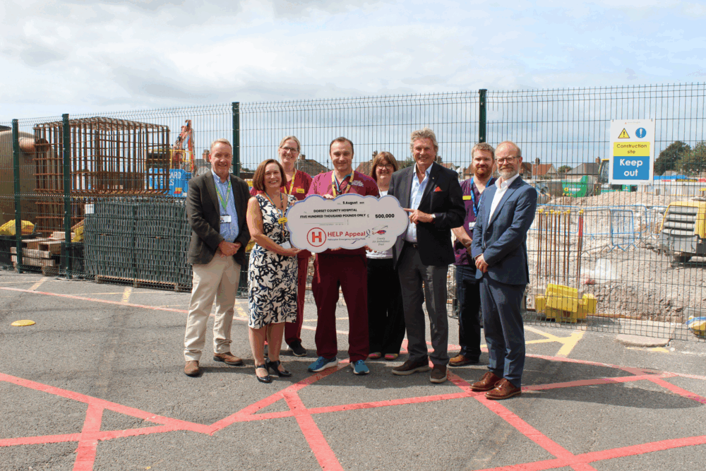 Robert Bertram, Chief Executive of the HELP Appeal, presents the final £500,000 instalment of their £2million donation to Dorset County Hospital staff Picture: DCH