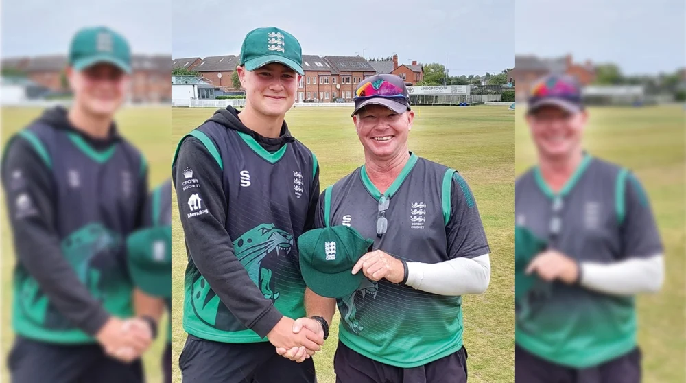 Paul Lawrence, Head Coach of Dorset’s Men’s First team, handing Alfie his cap Picture: Bryanston School