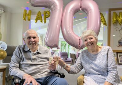 The couple celebrating their anniversary with a glass of fizz Picture: Care South