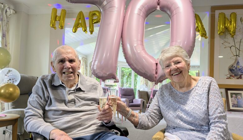 The couple celebrating their anniversary with a glass of fizz Picture: Care South