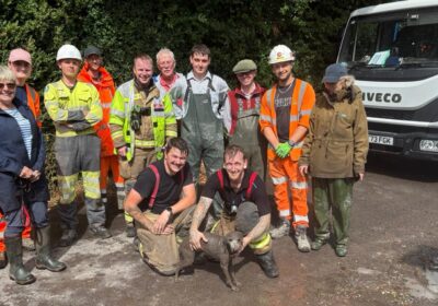 A suitably muddy Ruby with her rescuers Picture: Wiltshire Council