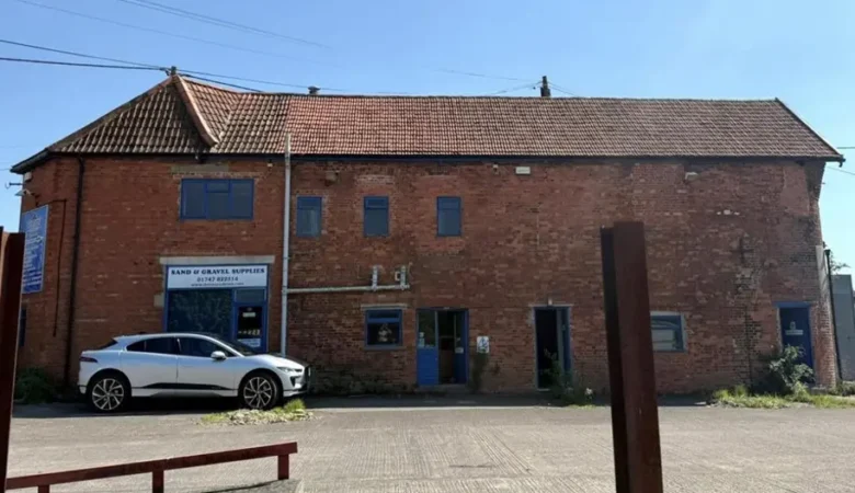 The former office building and store would be turned into a cafe and offices under the plans Picture: Proctor Watts Cole Rutter