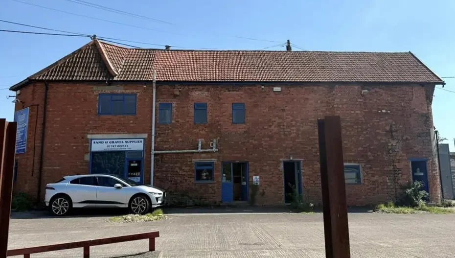 The former office building and store would be turned into a cafe and offices under the plans Picture: Proctor Watts Cole Rutter