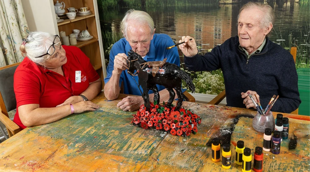 Companionship team member Ruth Telford and residents Ian Loftus and Tony Stock making the sculpture Picture: Newstone House/Colten Care