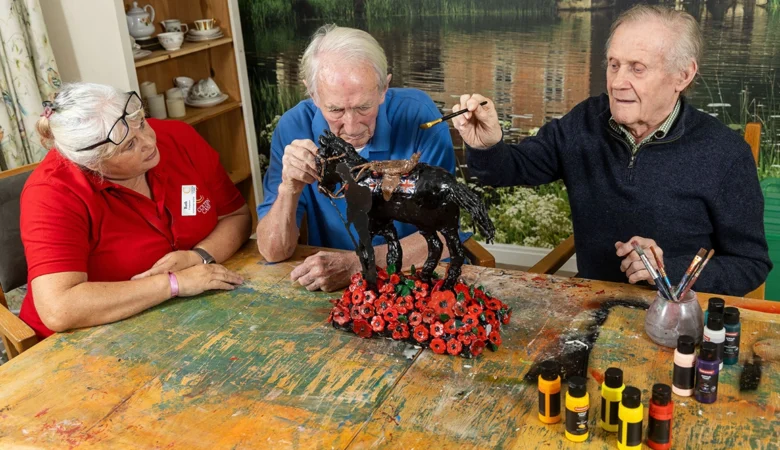 Companionship team member Ruth Telford and residents Ian Loftus and Tony Stock making the sculpture Picture: Newstone House/Colten Care