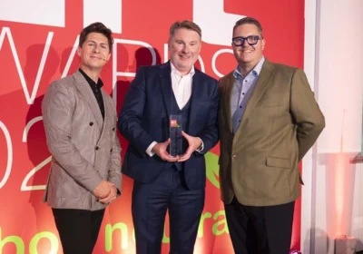 Matt Renaut managing director of Dacombes of Wimborne (centre) picking up one of his two ERT awards Picture: Dacombes of Wimborne