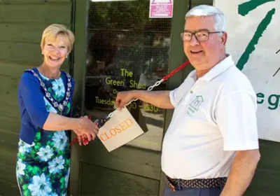 Mayor of Sherborne, Jill Warburton, and Antony Chambers, chairman of The Green Shed Sherborne, officially opening The Green Shed Sherborne at Castle Gardens