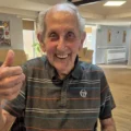 Gerald is excited ahead of his ride out in a motorcycle sidecar