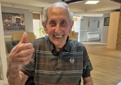 Gerald is excited ahead of his ride out in a motorcycle sidecar