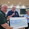 Richard Fagan of Drumgrange Ltd presents a £500 sponsorship cheque to Dorchester Royal Naval Association treasurer Pat Knight and chair Steve Armstrong