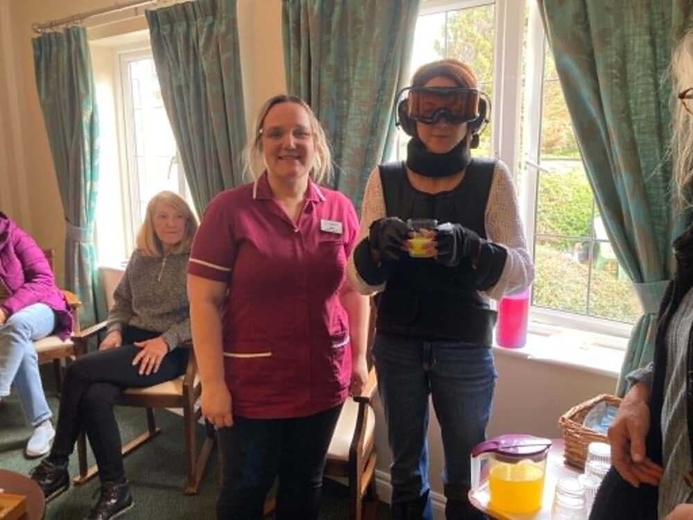Staff at The Malthouse care home in Gillingham using a GERT age simulation suit