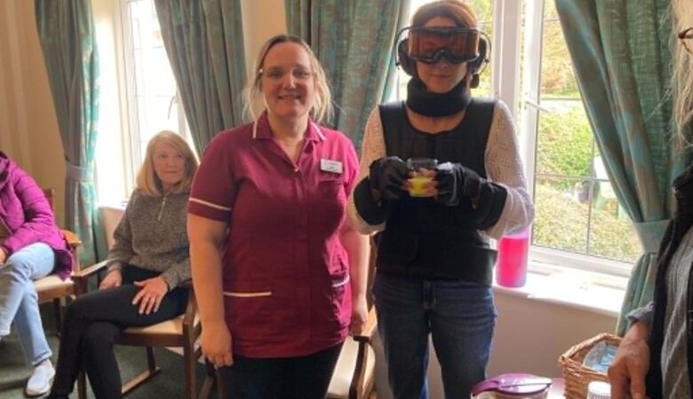 Staff at The Malthouse care home in Gillingham using a GERT age simulation suit