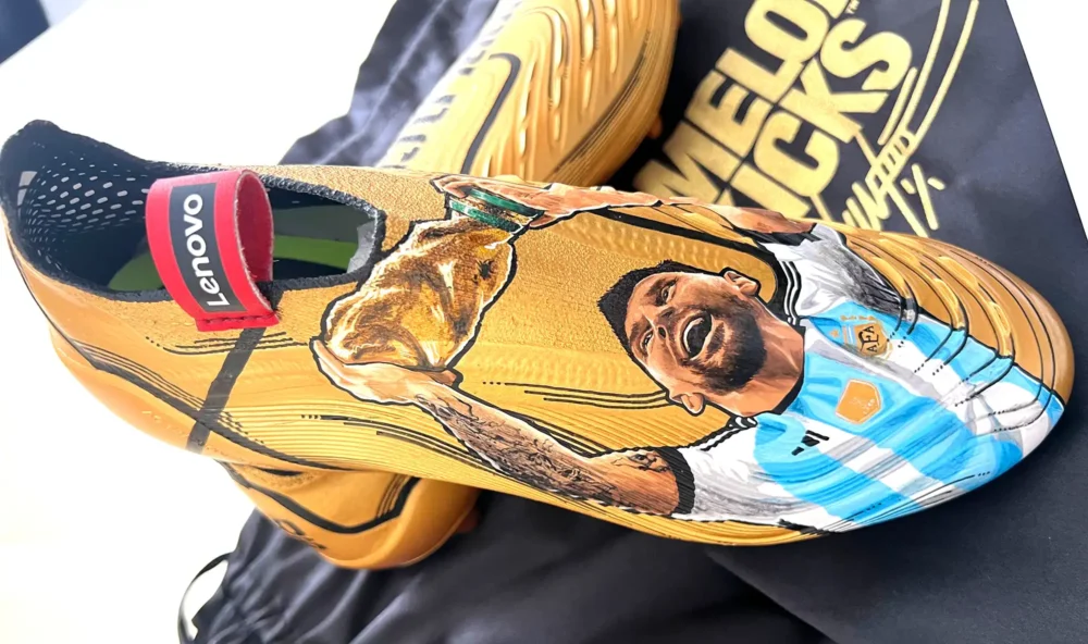 The hand-painted football boots feature Argentina star Lionel Messi