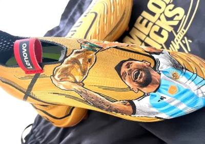 The hand-painted football boots feature Argentina star Lionel Messi