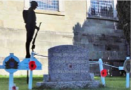 The Lone Soldier stands over the Field of Remembrance in the Blandford churchyard 