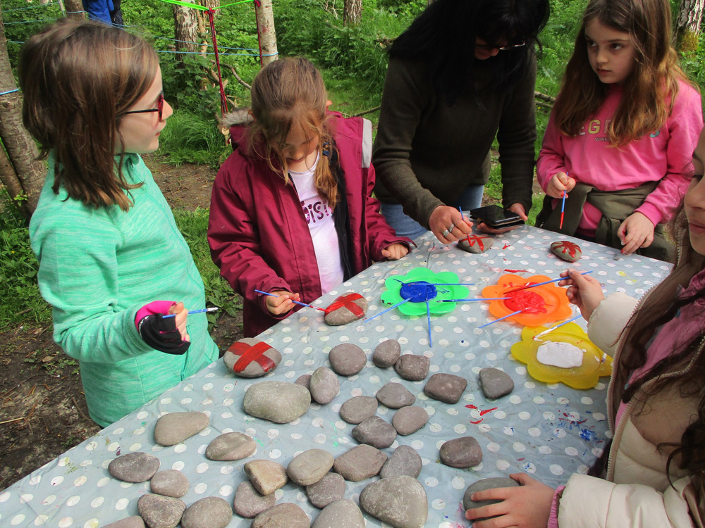 Children at St Andrew’s Primary School in Yetminster had an afternoon of forest school arts and crafts in honour of the Coronation, including painting flags and crowns and cooking drop scones.