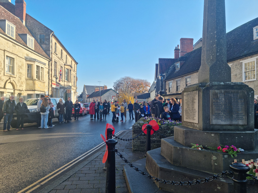 Members of the Police, firefighters and youth organisations (including the Brownies, pictured here) gathered around the war memorial in Mere for the well-attended Remembrance Sunday commemorations. PHOTO: Sue Jeans