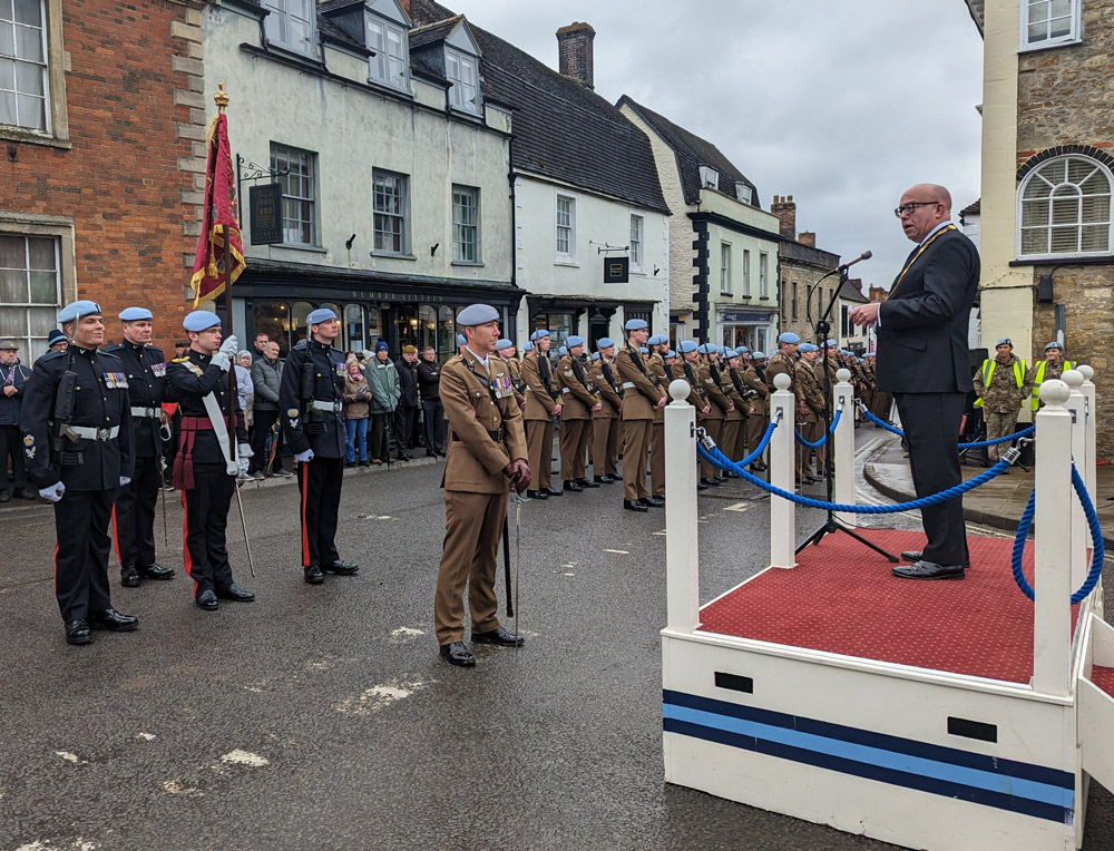 Mayor of Wincanton Cllr Howard Ellard addresses the parade