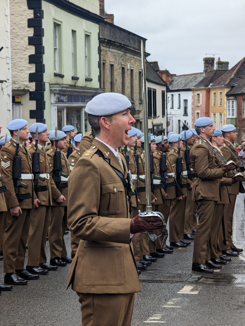 Officer giving orders to troops on the High Street